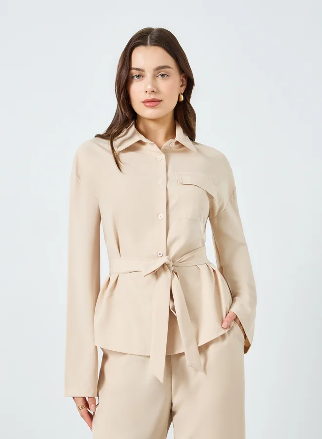 ستايلي طقم منسق من بنطال بأرجل واسعة وبلوزة بحزام خصر